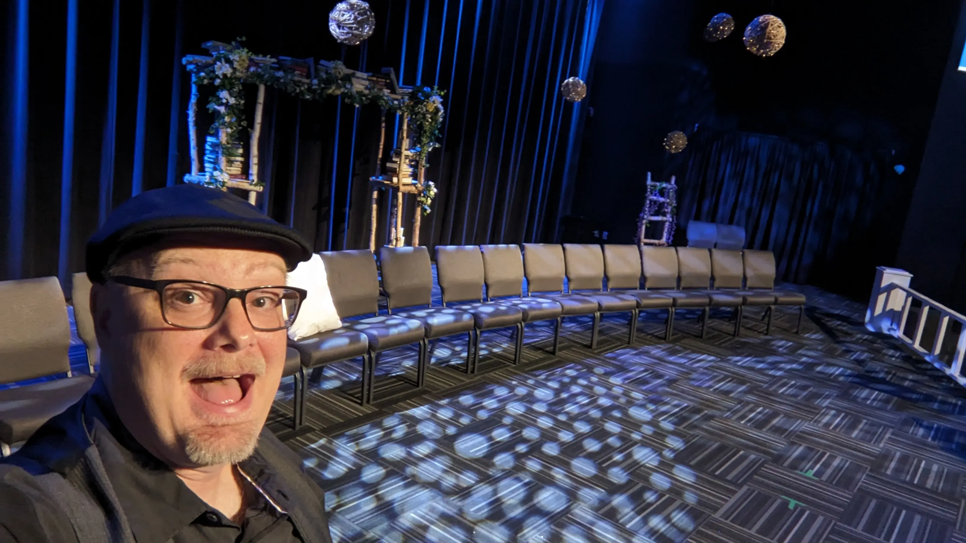 Company Christmas party audience laughing at live entertainment